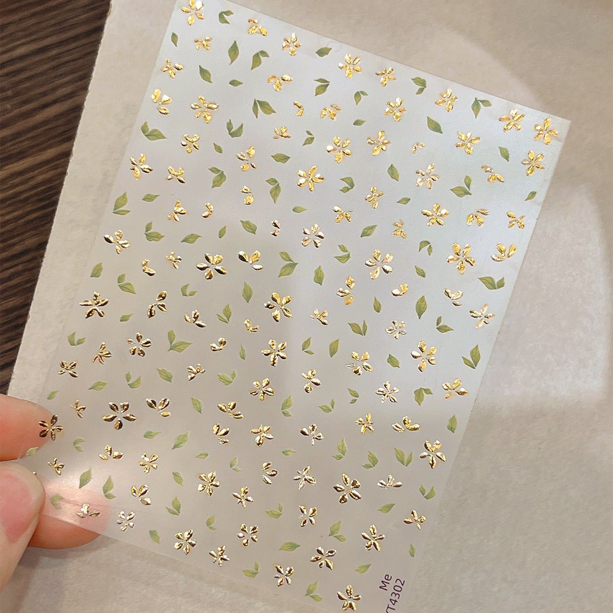 3D gold-foil floral nail stickers with metallic petals and leaves for DIY nail art