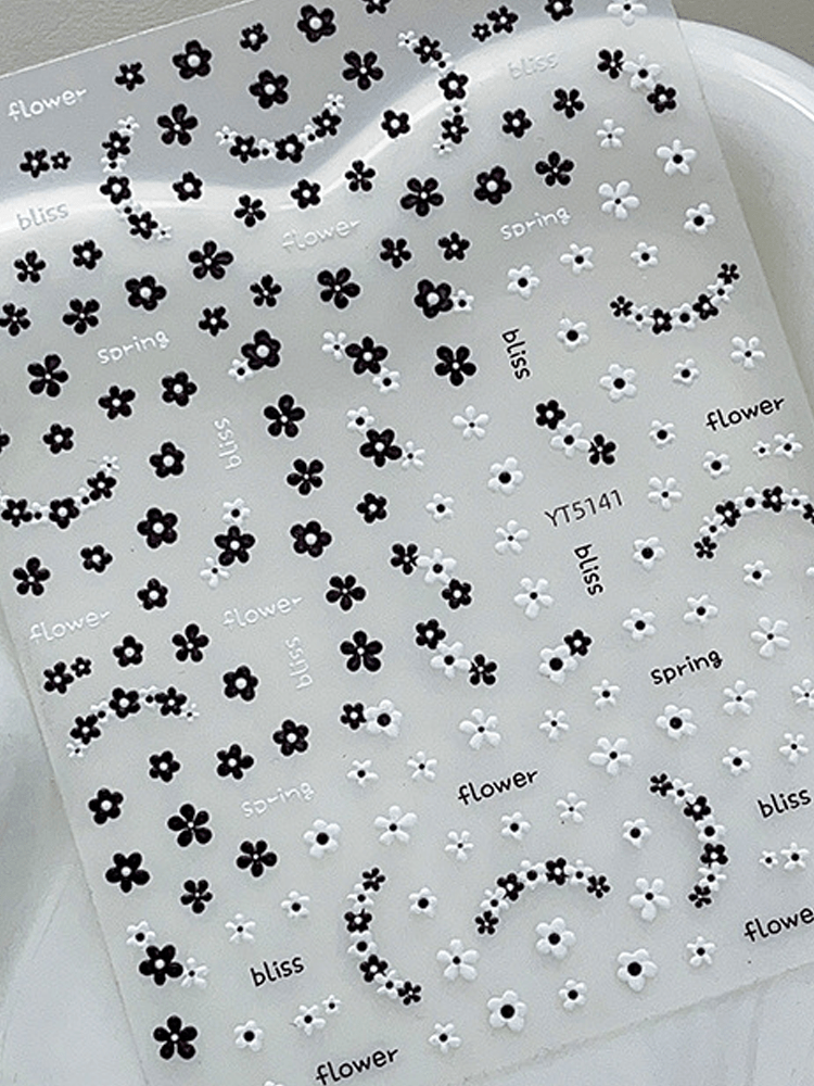3D embossed mini floral nail stickers with charming cartoon black and white blooms for DIY nail art