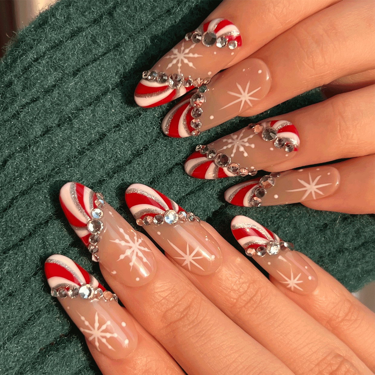 Christmas press on nails on hand. Close up. Holiday vibe