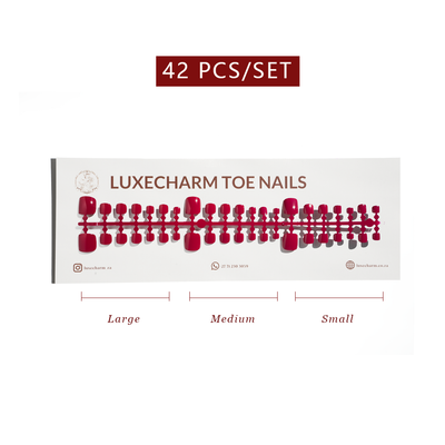 Packaging of LuxeCharm toe nails with size labels on a white background. Fuchsia press-on toenails 42 piece set — bright pink pedicure