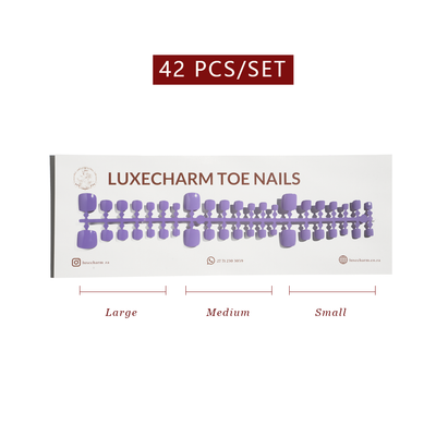 Display of LuxeCharm toe nails with size labels on a white background. Lavender press-on toenails 42 piece set — soft lilac pedicure