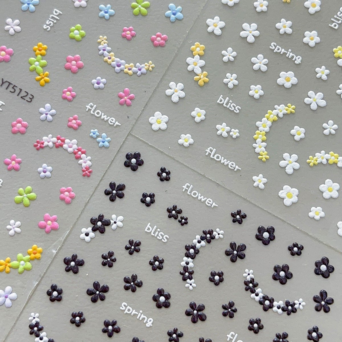 3D embossed mini floral nail stickers with charming cartoon blooms, multi-colored nail sticker sheets