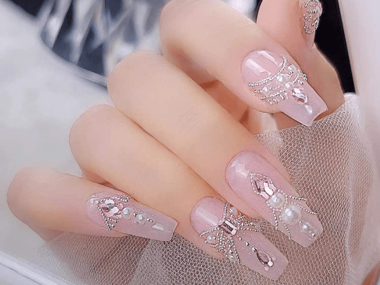 silver mini metal beads on hand display