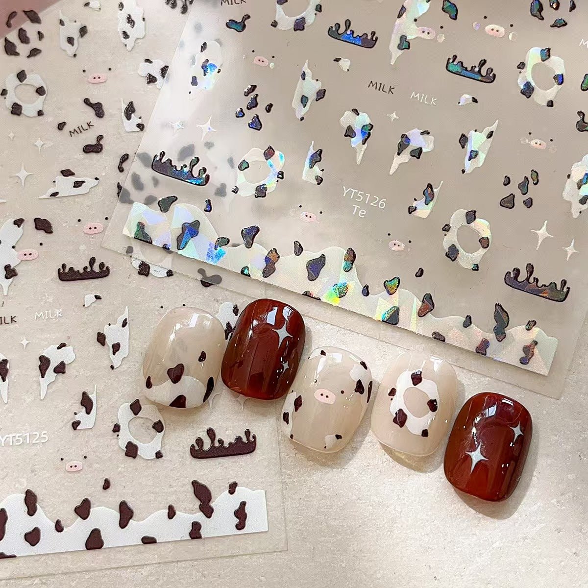 Shell shine cow print nail decals with pearlescent finish on press on nails