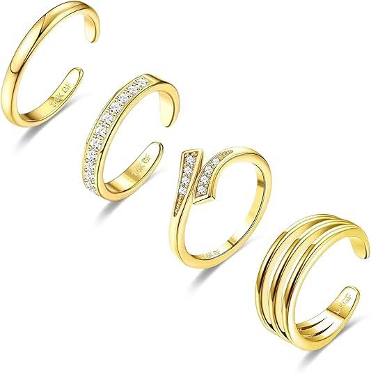 Set of gold adjustable toenail rings with various designs on a white background. LuxeCharm press on nails.