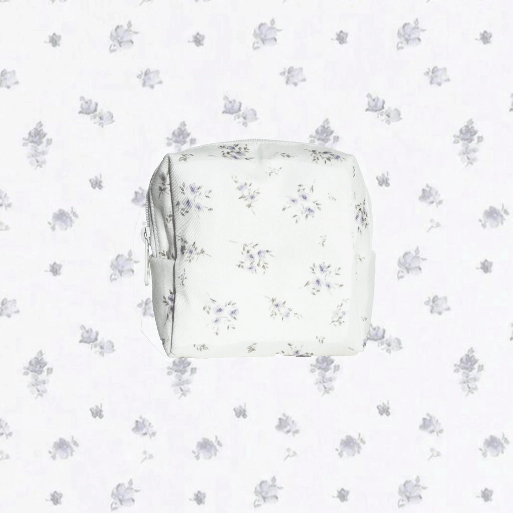 Handmade carry pouch with purple floral pattern on a white background. LuxeCharm