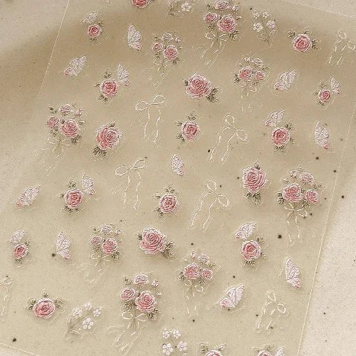 Translucent sheet with pink floral and decorative elements on a beige background. LuxeCharm nail stickers