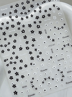 3D embossed mini floral nail stickers with charming cartoon black and white blooms for DIY nail art 