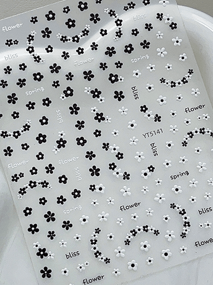 3D embossed mini floral nail stickers with charming cartoon black and white blooms for DIY nail art 