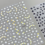 3D embossed mini floral nail stickers with charming cartoon blooms in yellow and black 