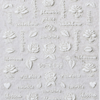 Decorative embossed paper with floral and text patterns on a light gray background. 5D luxury lace flower nail stickers. LuxeCharm