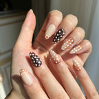 LuxeCharm Bambi Haze animal-inspired press-on nails styled on hand with a glossy short almond finish