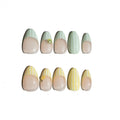 Set of nail art designs on a white background. Avocado green and white striped & yellow and white striped nail designs featuring 3D kiwi and lemon sculpted. LuxeCharm press on nails