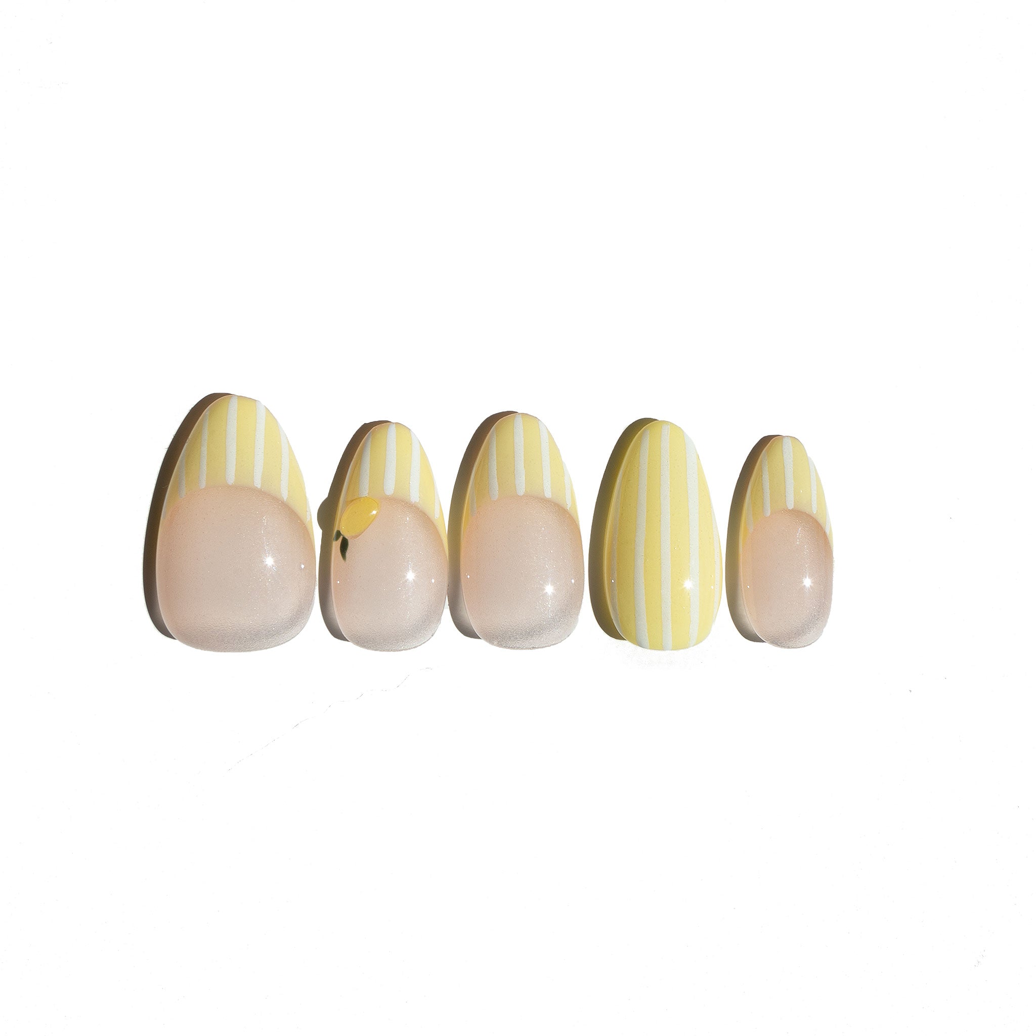 Set of five fake nails with a white and yellow striped design featuring 3d lemon shape sculpted on a white background. LuxeCharm press on nails