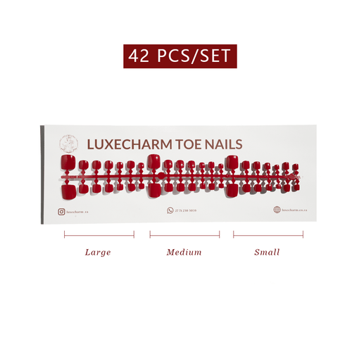 Display of LuxeCharm toe nails with size labels on a white background. Classic Red press-on toenails 42 piece set — classic red pedicure