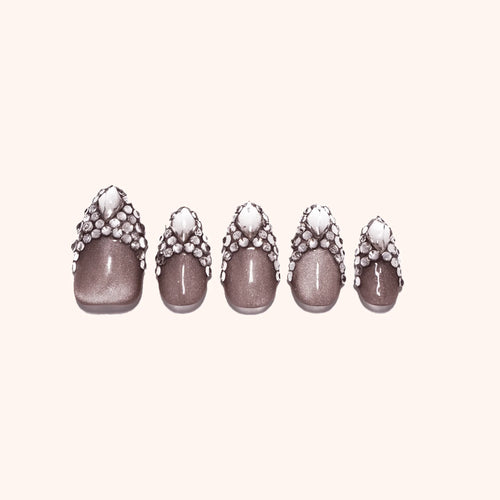 Classic French Diamond Nails with Rhinestone and Gem Accent.