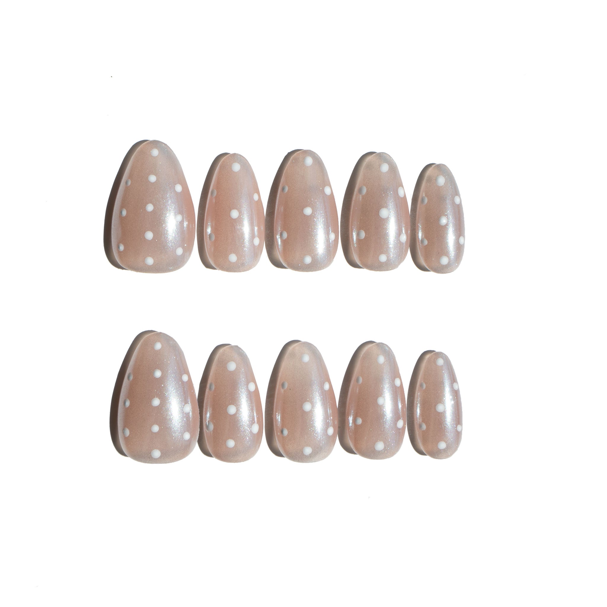 Ten handmade press on nails with polka dot design on a white background. Affordable luxury fake nails. LuxeCharm