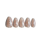 Five handmade press on nails with polka dot design on a white background. Affordable luxury fake nails. LuxeCharm
