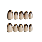 Set of ten tortoiseshell patterned LuxeCharm press on nails on a white background
