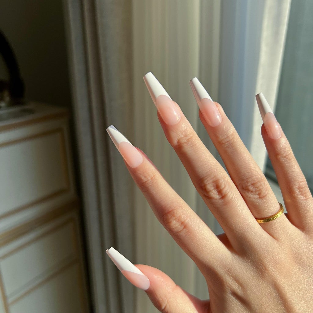 Hand with LuxeTip French long coffin press on nails in pink color