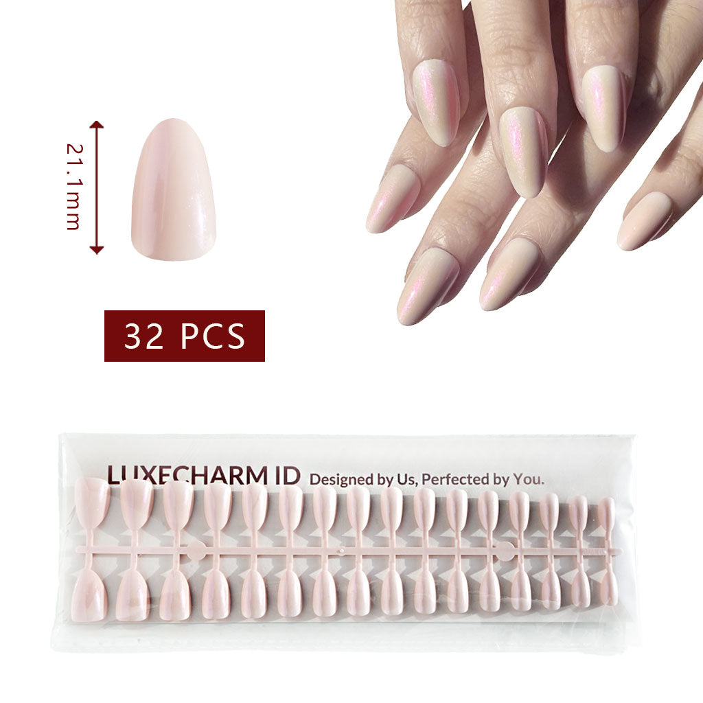 Set of pink false nails with a hand model, packaging, and measurement details. LuxeCharm Opal haze aurora press on nails, 32 pieces.