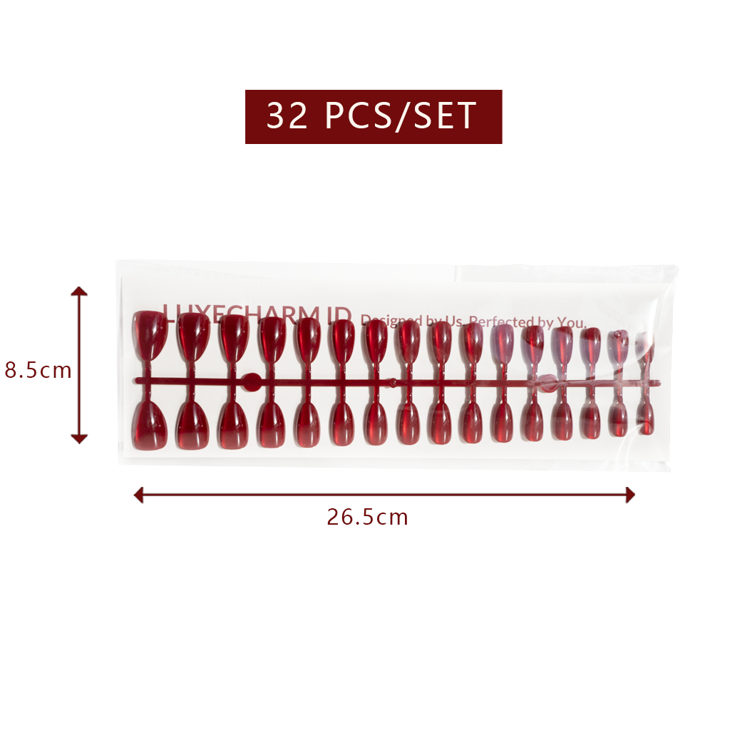 Packaging of 32 LuxeCharm Ruby Marble Cat-Eye Short Almond Nails with dimensions and brand name on a white background