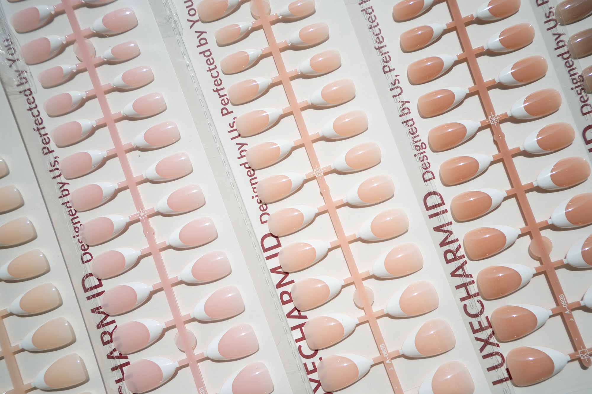 LuxeCharm LuxeTip Sets in different base color in the LuxeCharm package.