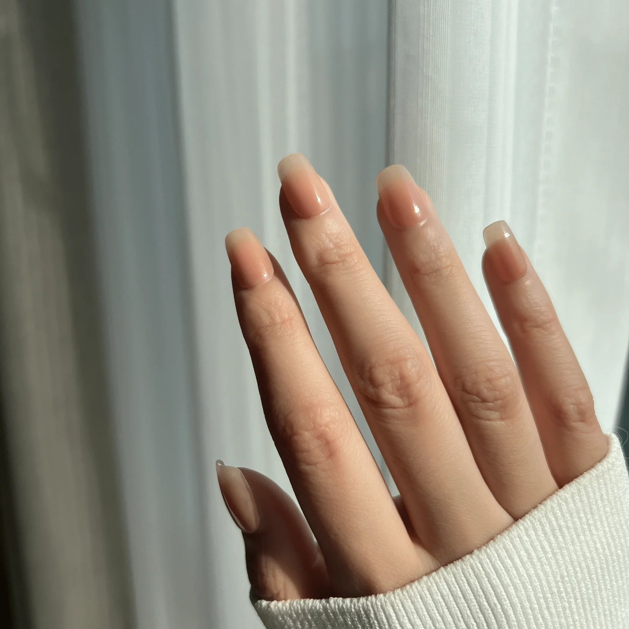 LuxeTip nude beige ombré press-on nails extra short square on hand display