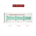 Packaging of LuxeCharm toenails with size labels on a white background. Mint press-on toenails 42 piece set — mint green pedicure