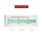 Packaging of LuxeCharm toenails with size labels on a white background. Mint press-on toenails 42 piece set — mint green pedicure