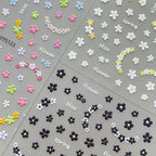 3D embossed mini floral nail stickers with charming cartoon blooms, multi-colored nail sticker sheets
