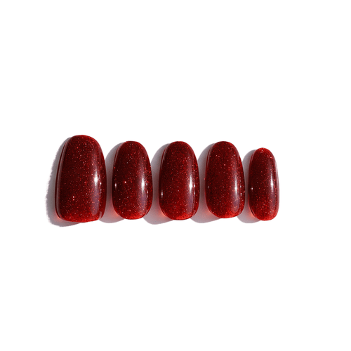 Five red glitter nails with top coat.  Luxecharm press on nails