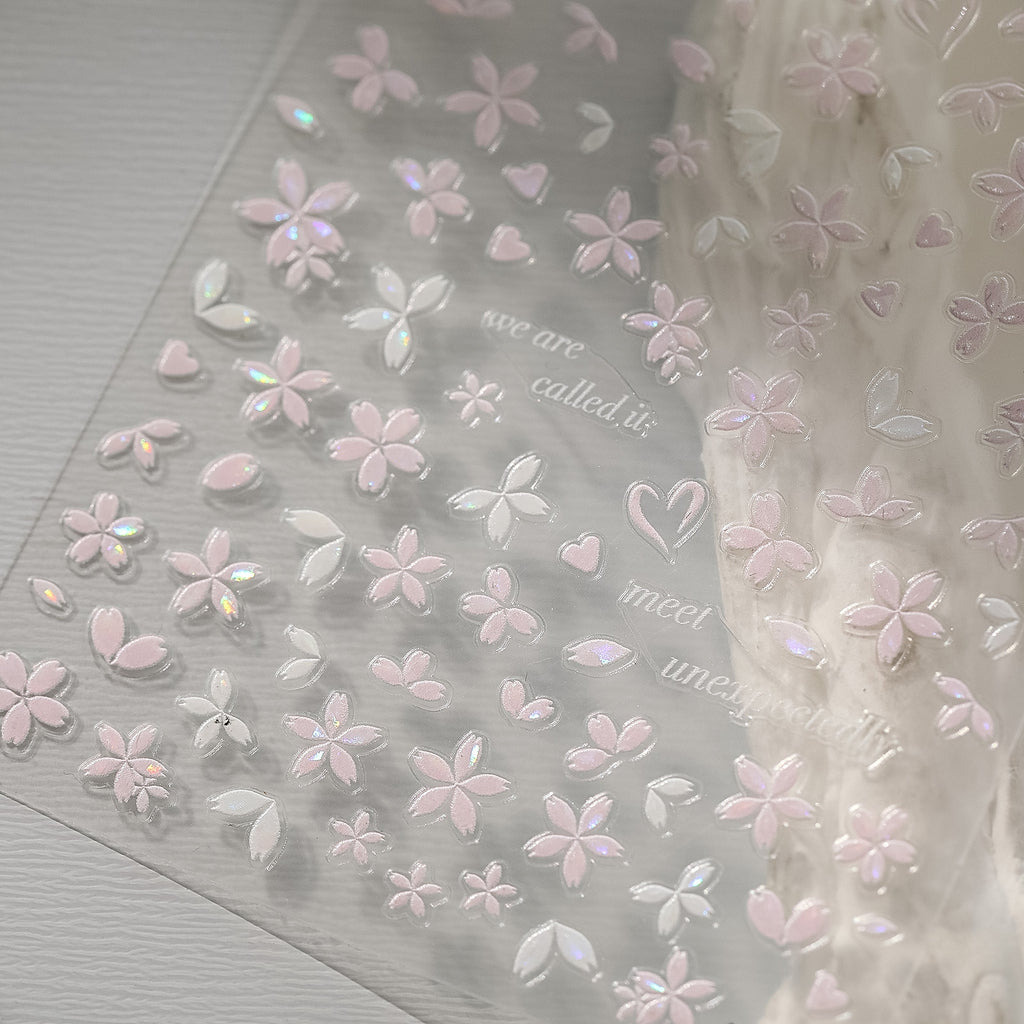 Sakura pink petal nail stickers with iridescent shell effect, close up look