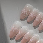 Sakura pink petal nail stickers with iridescent shell effect, close up look on press on nails