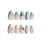 Set of decorative nail art with nail designs on a white background. Pink and white striped & blue and white striped nail designs featuring 3D cherry and blueberry sculpted. LuxeCharm press on nails