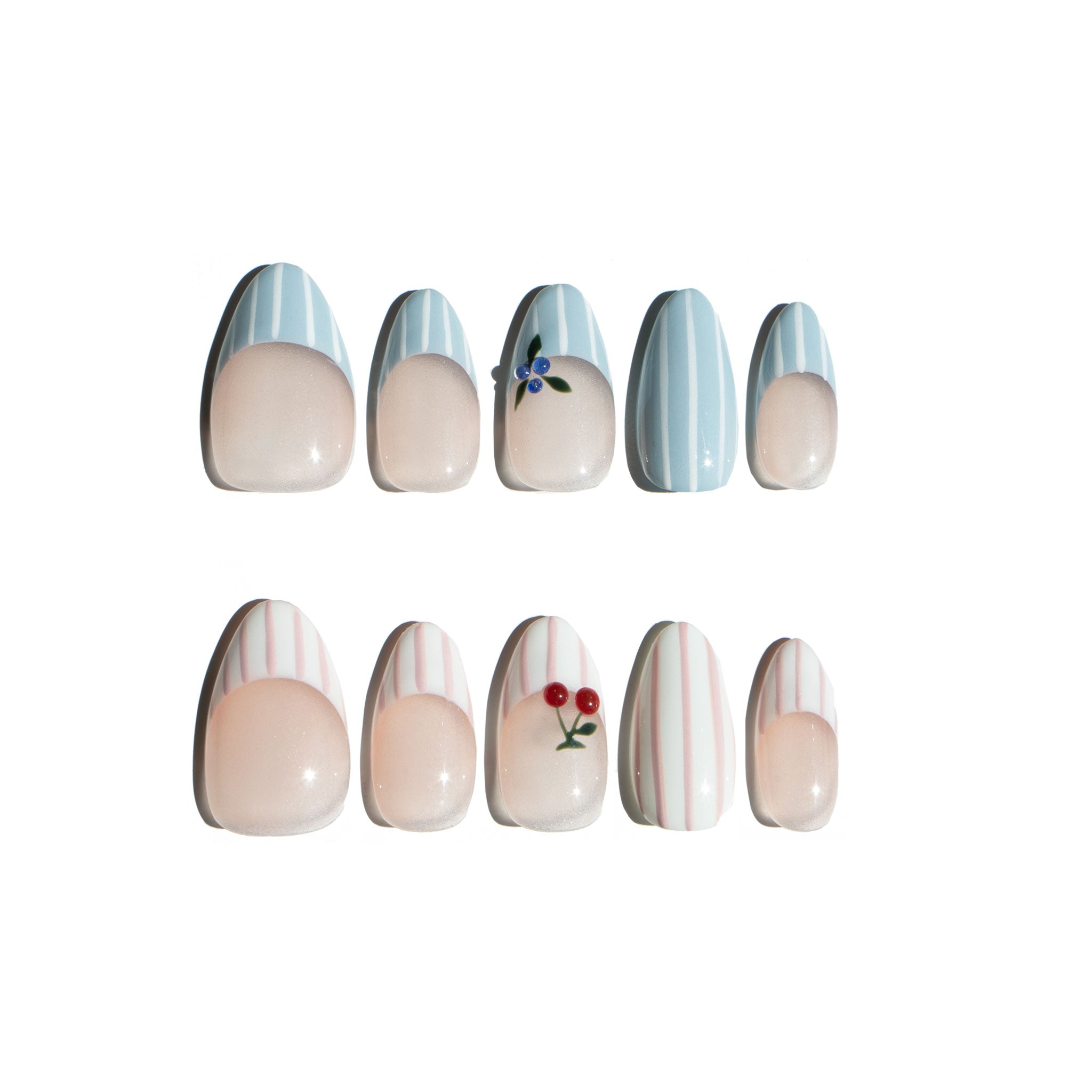 Set of decorative nail art with nail designs on a white background. Pink and white striped & blue and white striped nail designs featuring 3D cherry and blueberry sculpted. LuxeCharm press on nails