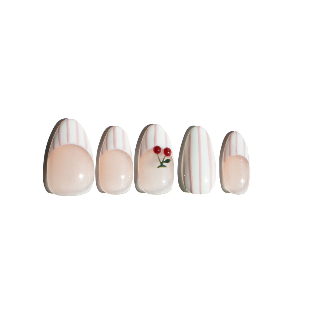 Set of five fake nail art designs on a white background. Pink and white striped nail designs featuring 3D cherry sculpted. LuxeCharm press on nails