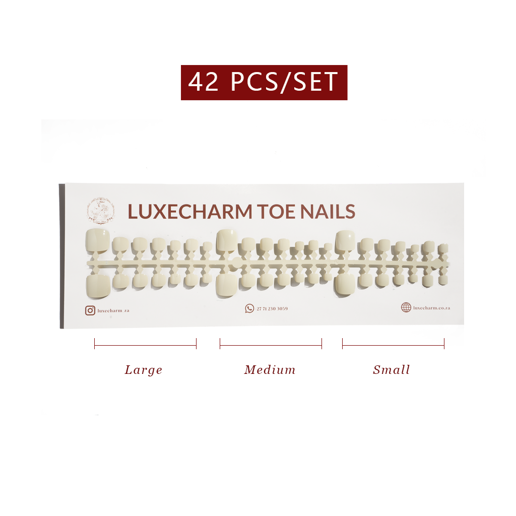 Set of LuxeCharm toe nails with size labels on a white background. Vanilla press-on toenails 42 piece set — creamy white pedicure