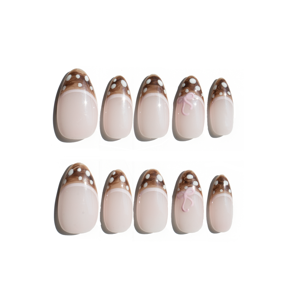 Set of ten LuxeCharm press on nails featuring dusty pink tones and a small 3D bow accent on a white background