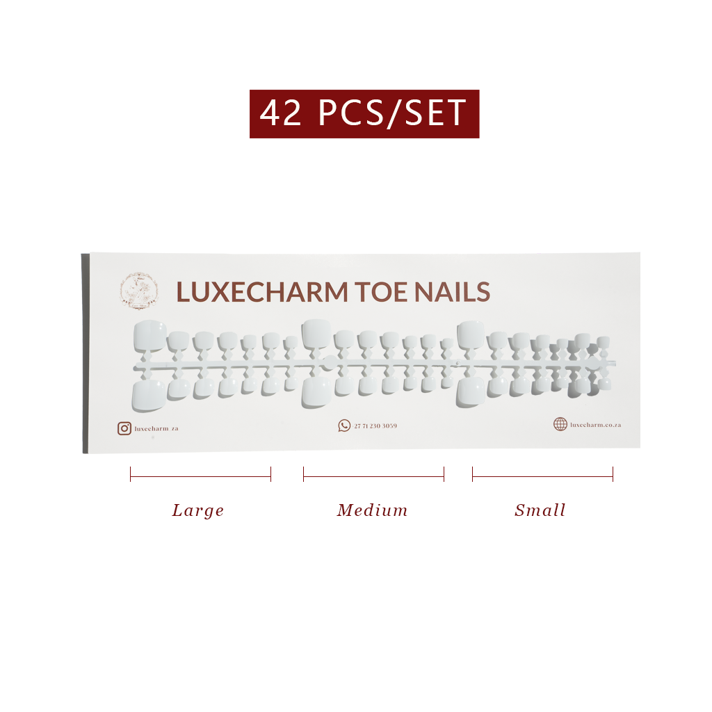 Set of LuxeCharm toe nails with size labels on a white background. White press-on toenails 42 piece set — crisp white pedicure