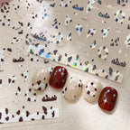 Shell shine cow print nail decals with pearlescent finish on press on nails
