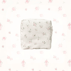 Pink Floral-patterned, handmade carry pouch on a white background with small floral designs. LuxeCharm Pouch